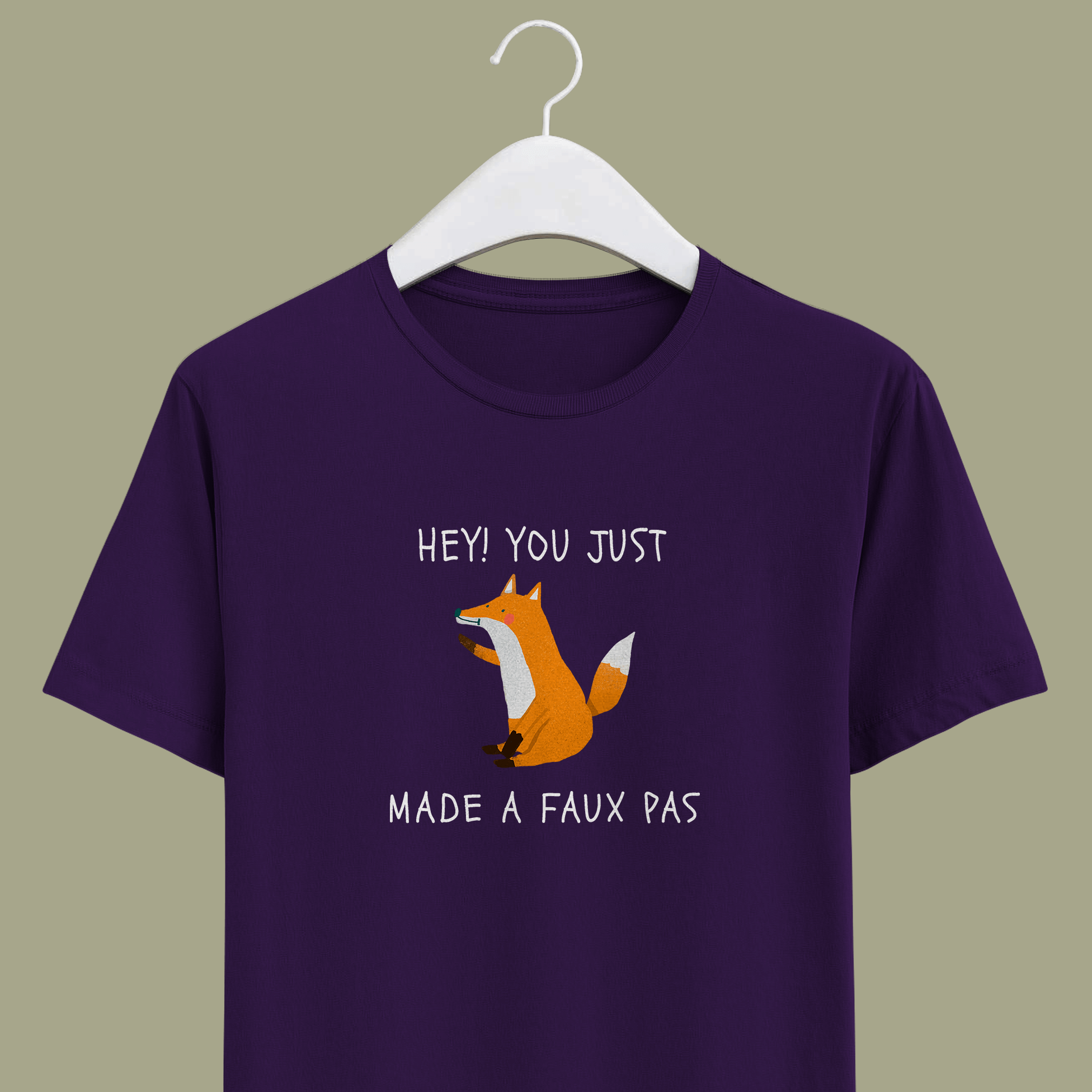 Joke on french word faux pas with orange sitting fox on purple cotton unisex t-shirt.