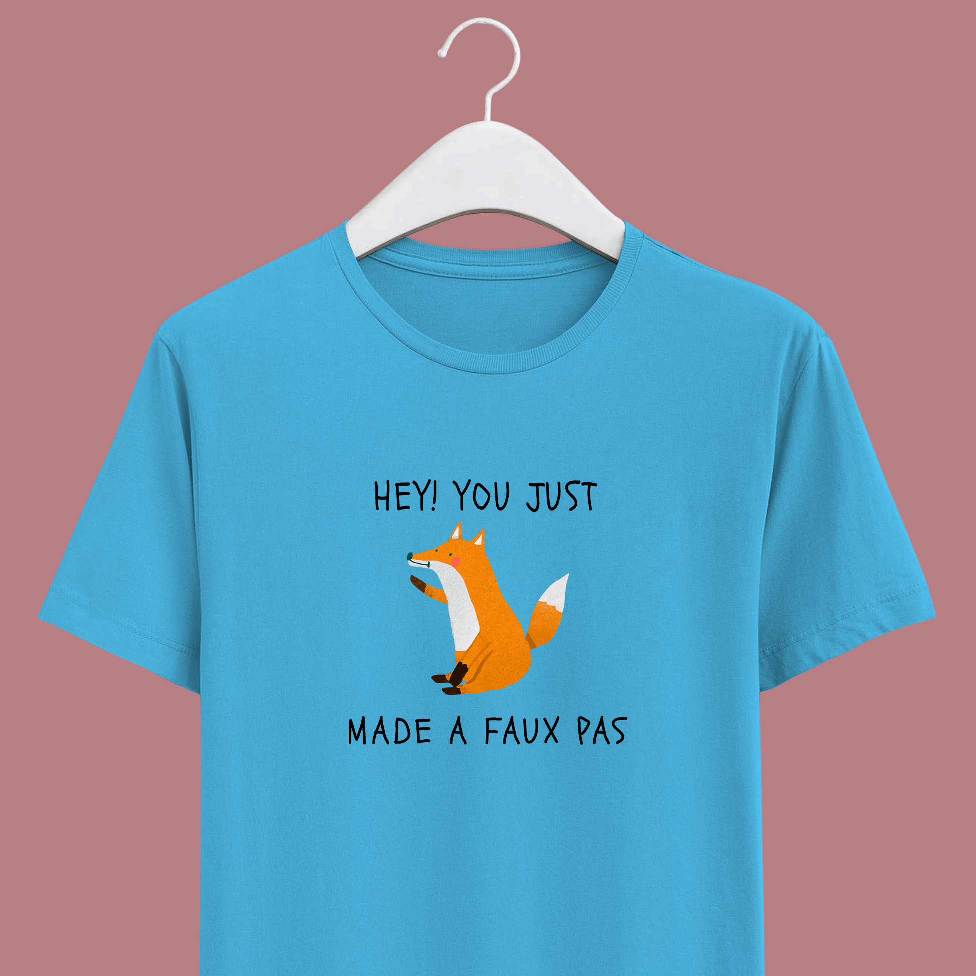 Joke on french word faux pas with orange sitting fox on sky blue cotton unisex t-shirt.