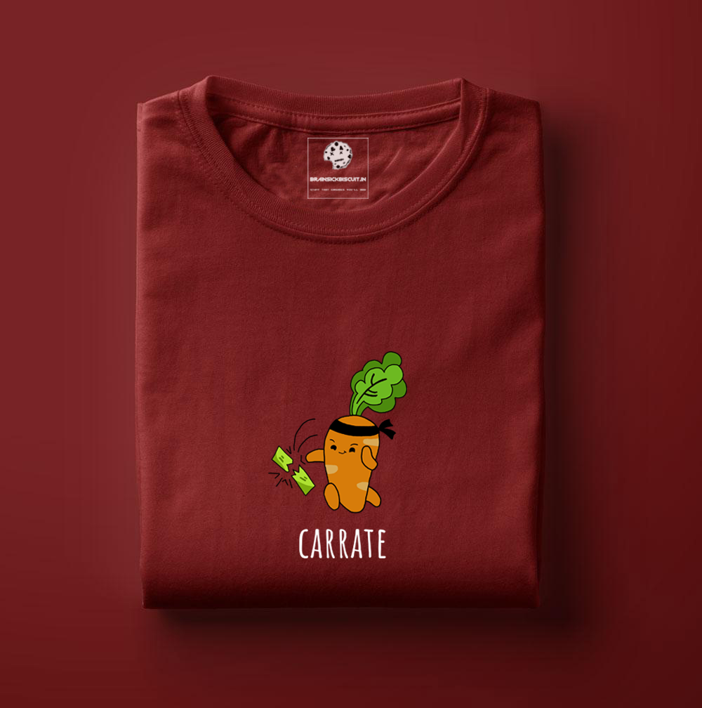 orange animated carrot with black headband chopping green leafy vegetables with karate chop on maroon t-shirt.